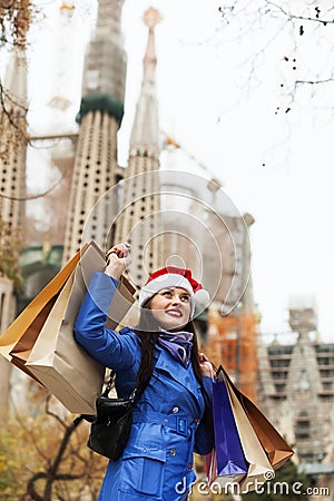 Smiling girl with purchases in Barcelona Editorial Stock Photo