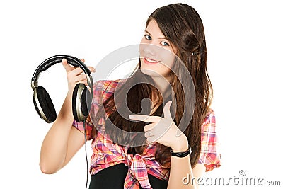 A smiling girl shows a finger on headsets Stock Photo