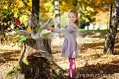 Smiling girl in the autumn park Stock Photo