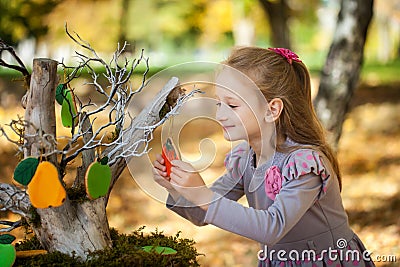 Smiling girl in the autumn park Stock Photo