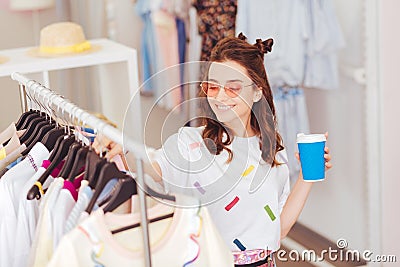 Smiling girl spending her leisure time in shopping mall Stock Photo