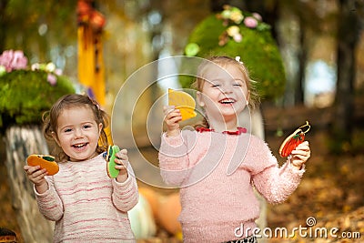 Smiling girls in the autumn park Stock Photo