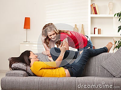 Smiling girls listening to music Stock Photo