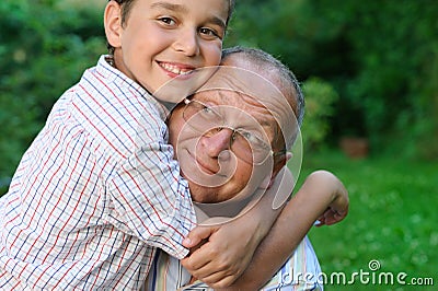 Smiling grandfather and grandson Stock Photo