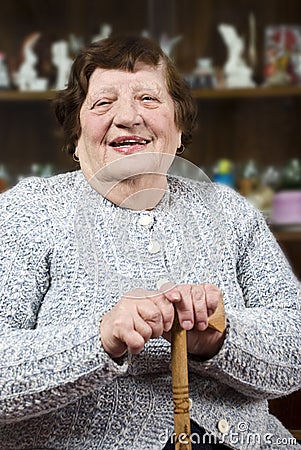 Smiling grandma with stick Stock Photo
