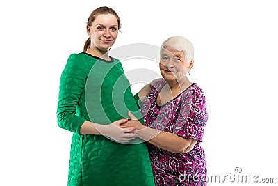 Smiling grandma touching belly of granddaughter Stock Photo