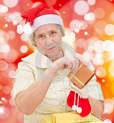 Smiling grandmother in Santa cap Stock Photo