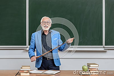 smiling grey hair professor holding Stock Photo