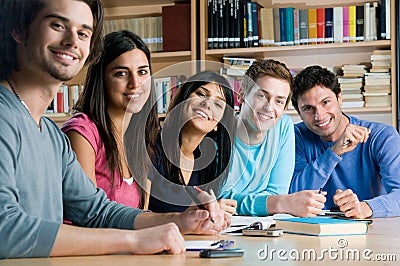 Smiling group of students in a library Stock Photo