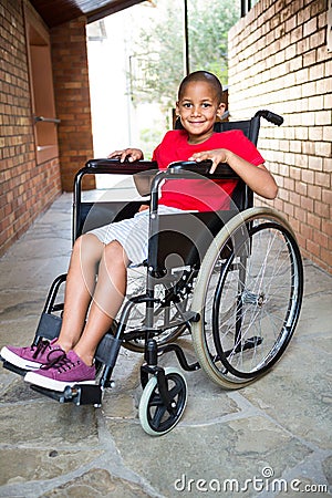 Smiling handicapped boy at school corridor Stock Photo