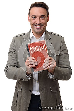 Smiling handsome man holds English textbook Stock Photo