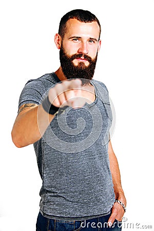 Smiling handsome Tattooed bearded man pointing at you Stock Photo