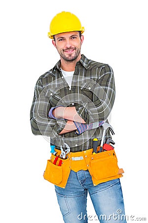 Smiling handyman wearing tool belt Stock Photo