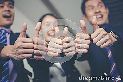 Smiling happy Businessman and Businesswomen celebrating success Stock Photo