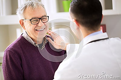 Smiling happy patient visit doctor Stock Photo