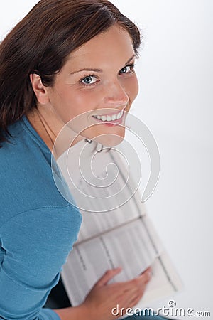 Smiling happy woman with book Stock Photo