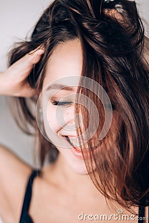 Smiling happy woman. Crazy girl on white background. Look down, wide smile, laughter Stock Photo