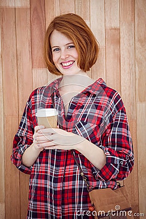 smiling hipster woman holding a take away coffee cup Stock Photo