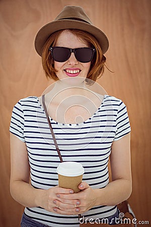 smiling hipster woman holding a take away coffee cup Stock Photo