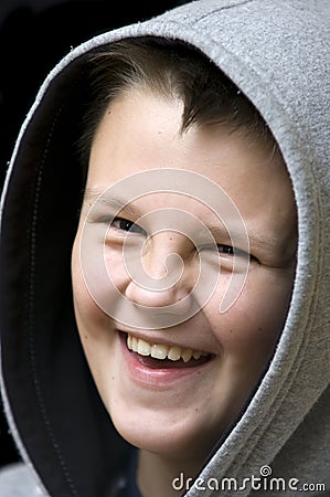 Smiling hooded boy Stock Photo