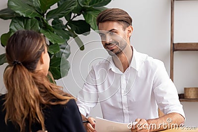 Smiling hr manager talking with candidate on job interview Stock Photo