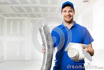 Hvac technician ready to install ventilation system in house Stock Photo