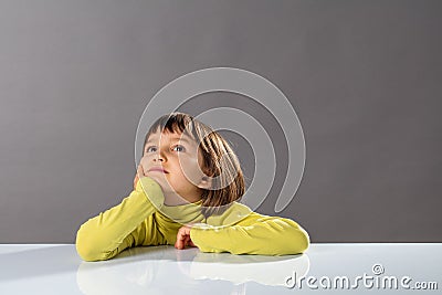 Smiling imaginative child looking away for concept of kid curiosity Stock Photo