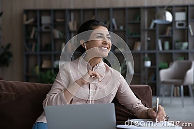 Smiling Indian woman study online on computer at home Stock Photo