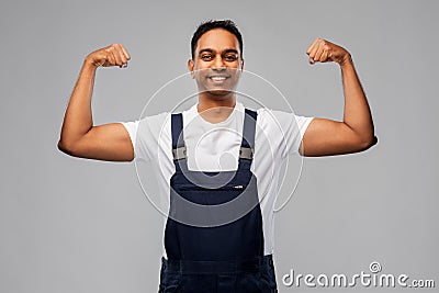 Smiling indian worker or builder showing his power Stock Photo