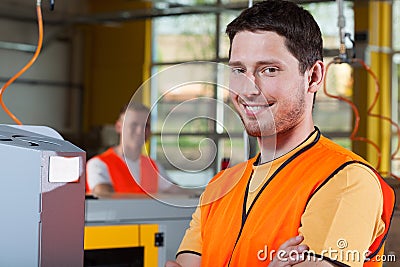 Smiling industrial worker at factory Stock Photo