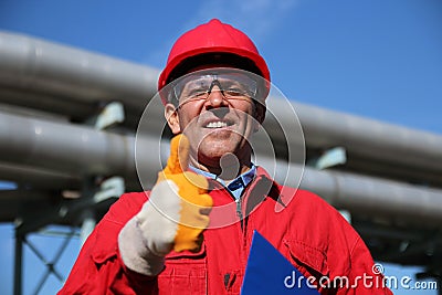 Smiling Industrial Worker Giving Thumb Up Stock Photo