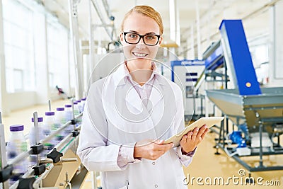 Smiling Inspector at Soy Milk Factory Stock Photo