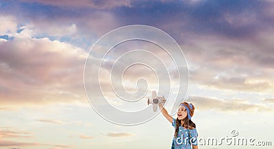 Smiling kid dreaming of becoming a pilot, future generation concept Stock Photo