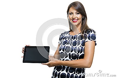 Smiling Lady in an Elegant Printed Dress Holding a Tablet Computer Stock Photo