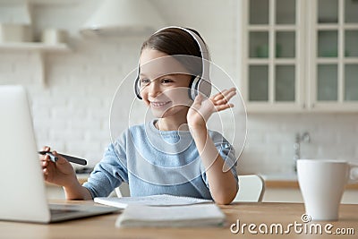 Little girl have video call on laptop at home Stock Photo