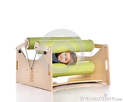 Smiling little child demonstrating usage of exercise set for persons with locomotor disorder, isolated on white, copy space Stock Photo