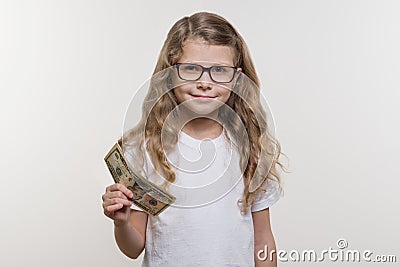 Smiling little girl with cash, Money, Finance and the Concept of People Stock Photo