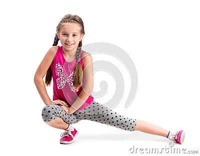 Smiling little girl doing exercise Stock Photo