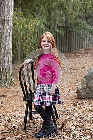 Smiling little red haired girl Stock Photo