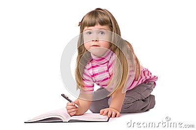 Smiling little writing girl Stock Photo
