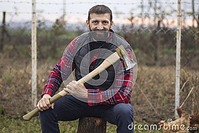 Smiling lumberjack with axe Stock Photo