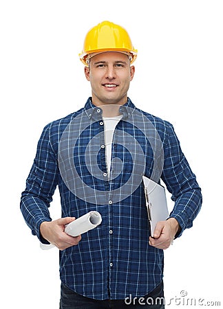 Smiling male builder in helmet with blueprint Stock Photo