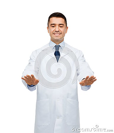Smiling male doctor touching something Stock Photo