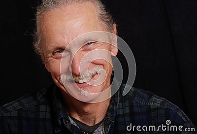 Smiling man on black background Stock Photo
