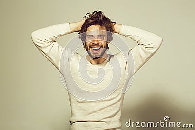 Smiling man with long uncombed hair wake up in morning Stock Photo