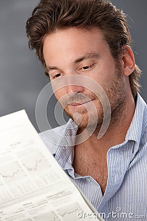 Smiling man with newspaper Stock Photo