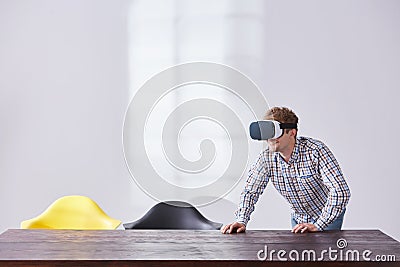 Smiling man plays virtual game Stock Photo