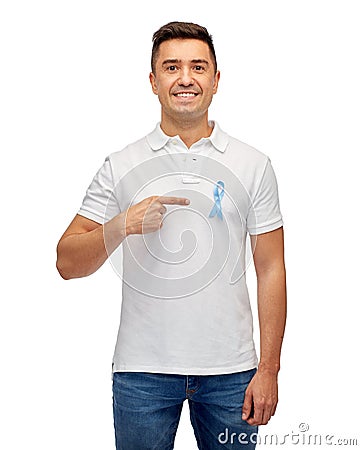 Smiling man with prostate cancer awareness ribbon Stock Photo