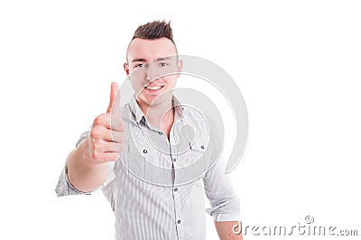 Smiling man showing like or thumb-up gesture Stock Photo