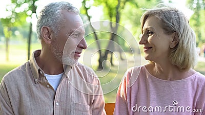 Smiling man and woman looking each other, romantic relations, date happiness Stock Photo